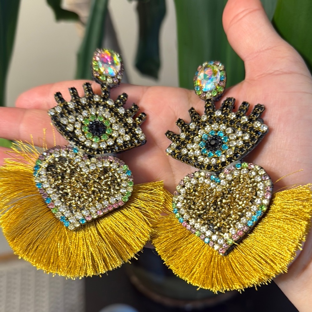 Gold and Black Statement Earrings with Eye and Heart Design